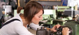 AI and changes in the world of work: a young woman at work in mechanical engineering AI and changes in the world of work: a young woman at work in mechanical engineering