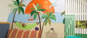 Day school: sofa area and wall mural Day school: sofa area and wall mural