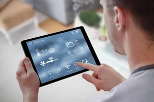 intelligent-house-column-man-on-tablet The intelligent networked home that also helps mum
